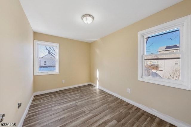 empty room featuring hardwood / wood-style floors