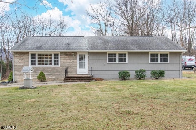 ranch-style home featuring a front yard