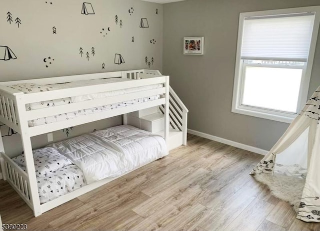 bedroom with light hardwood / wood-style flooring