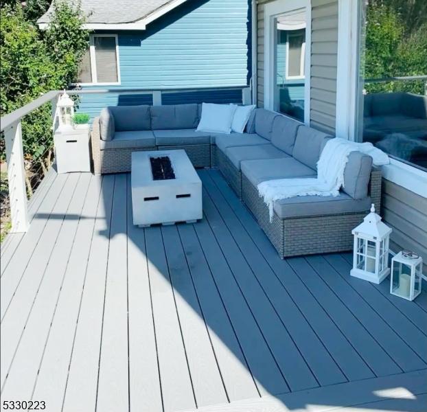 wooden terrace featuring an outdoor hangout area