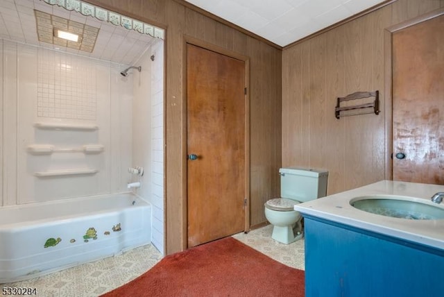 full bathroom with shower / bathing tub combination, vanity, toilet, and wooden walls