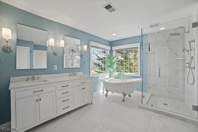 full bath featuring marble finish floor, a marble finish shower, visible vents, and a sink