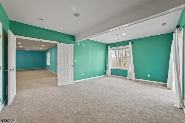 carpeted empty room with recessed lighting, beam ceiling, visible vents, and baseboards