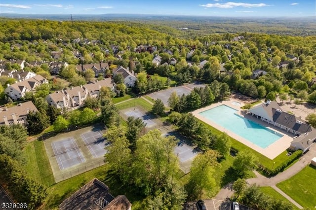 drone / aerial view with a view of trees