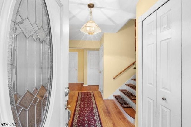 hallway with hardwood / wood-style flooring