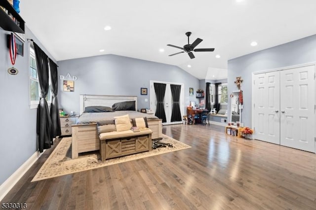 bedroom featuring ceiling fan, wood-type flooring, and vaulted ceiling