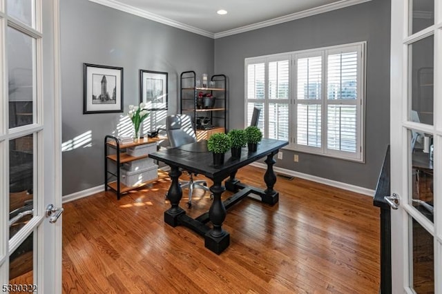 office area with hardwood / wood-style floors, crown molding, and french doors