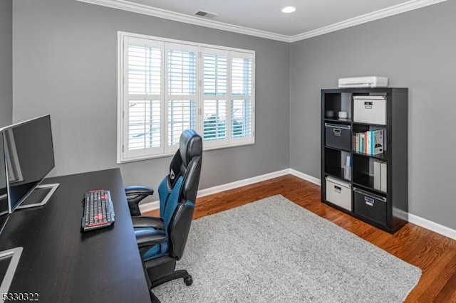 home office with crown molding and dark wood-type flooring