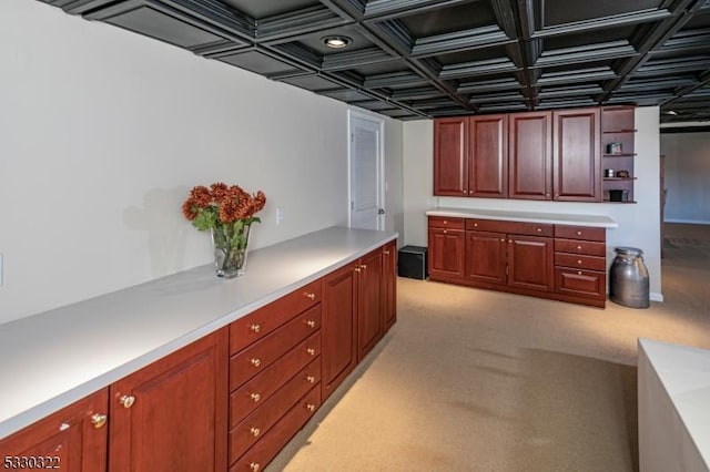 kitchen featuring light carpet and coffered ceiling