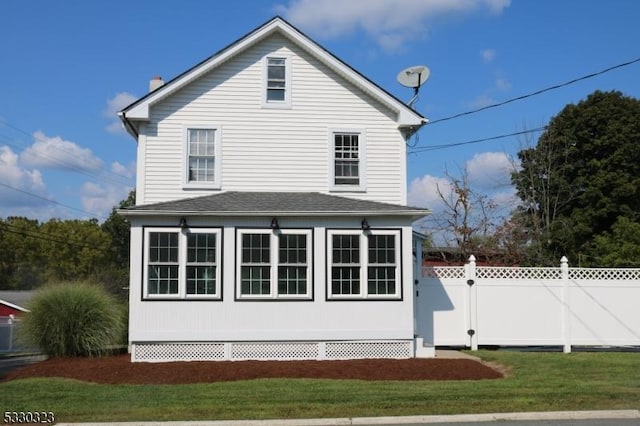 view of home's exterior featuring a lawn