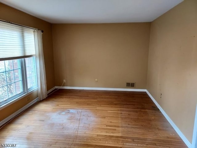 unfurnished room featuring light hardwood / wood-style flooring