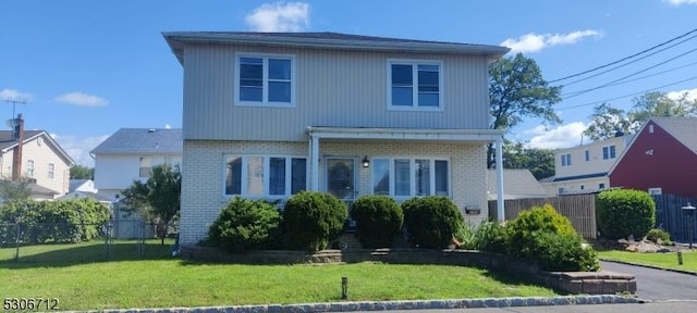 front facade with a front lawn