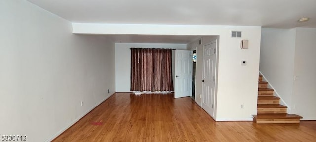 empty room with light hardwood / wood-style floors