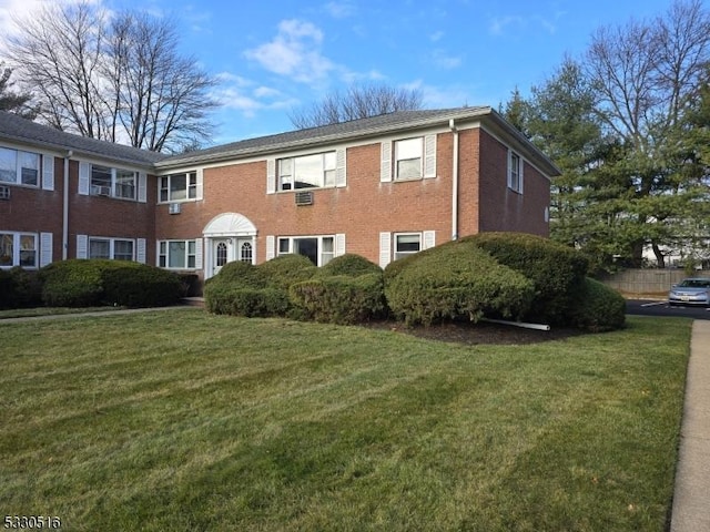 view of front of property with a front lawn