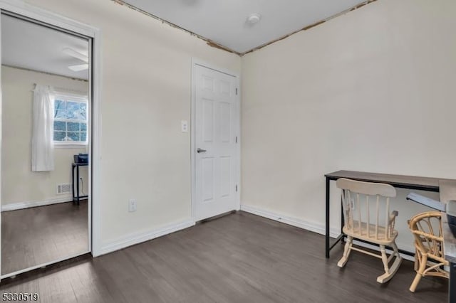 home office featuring dark hardwood / wood-style flooring