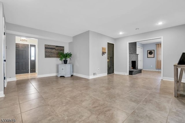 unfurnished living room with a fireplace