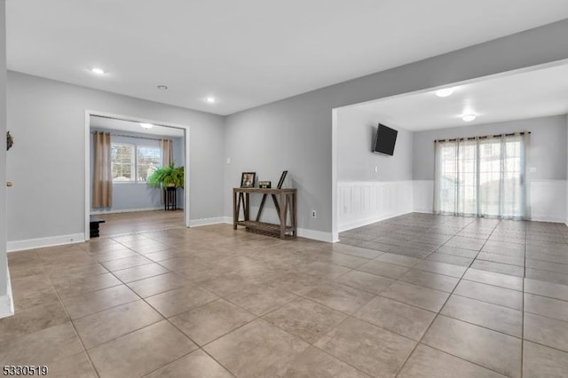 tiled spare room with plenty of natural light