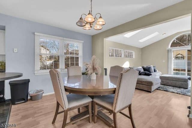 dining room featuring light hardwood / wood-style flooring and a chandelier