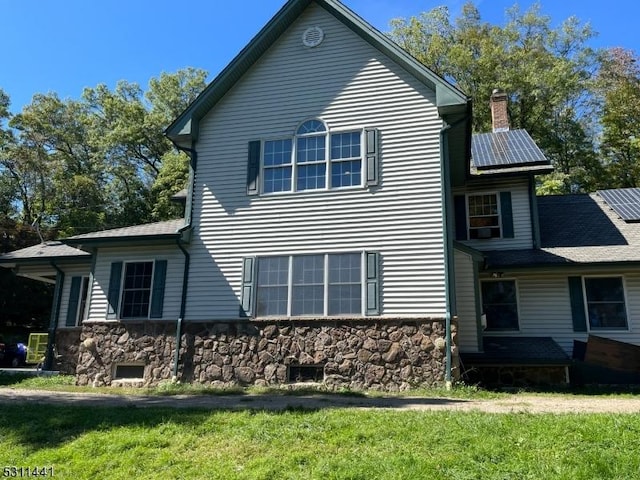 view of home's exterior featuring a yard