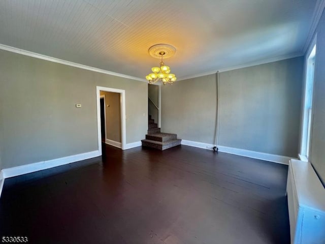 unfurnished living room with a chandelier, dark hardwood / wood-style flooring, and crown molding