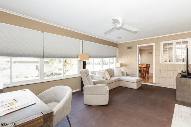 living room featuring ceiling fan and crown molding