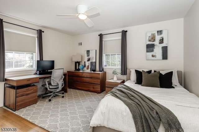 bedroom featuring ceiling fan and light wood-type flooring