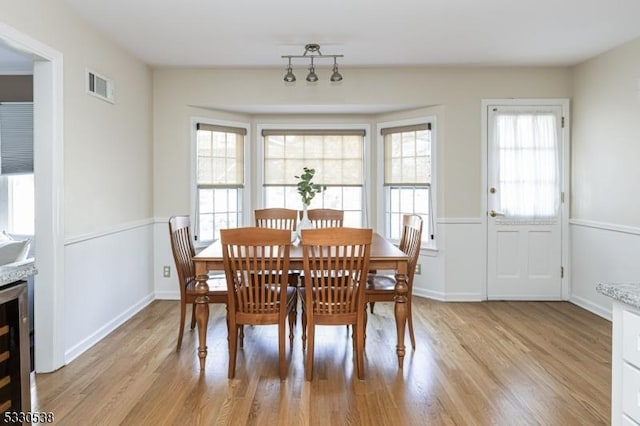 dining area with light hardwood / wood-style floors