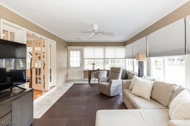 living room featuring ceiling fan and ornamental molding