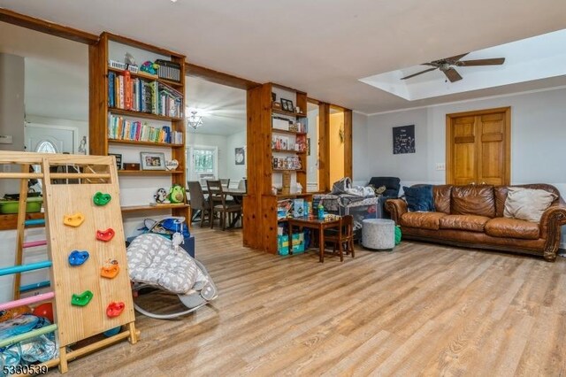 interior space with ceiling fan and wood-type flooring