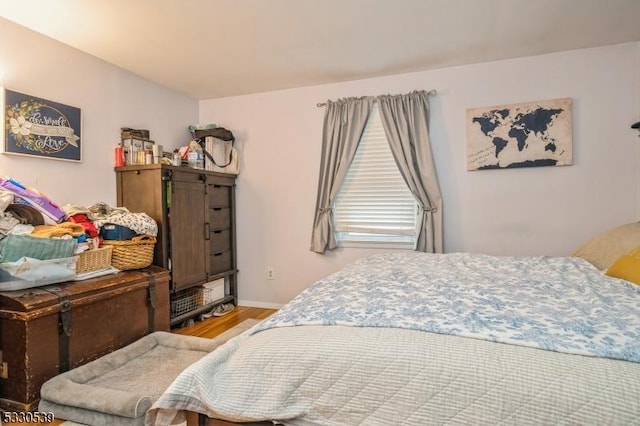 bedroom featuring wood-type flooring