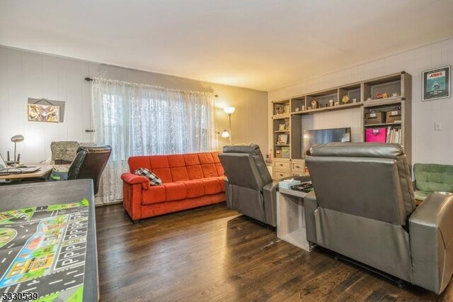 living room with dark wood-type flooring