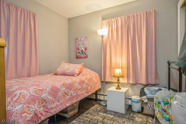 bedroom featuring a baseboard radiator