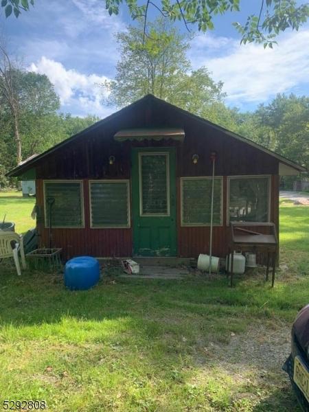 view of outbuilding with a yard