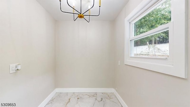 interior space featuring a notable chandelier