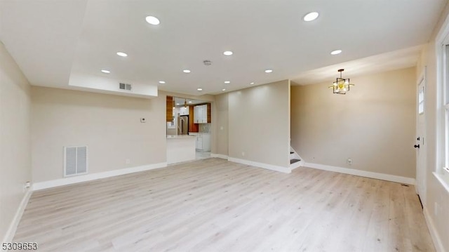 unfurnished room featuring light wood-type flooring