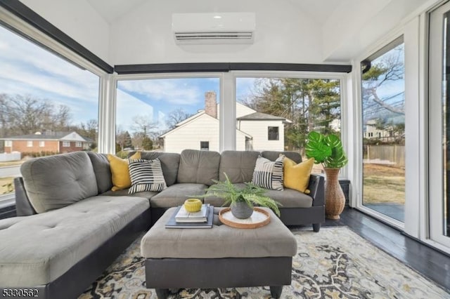 sunroom / solarium with a wall unit AC and vaulted ceiling