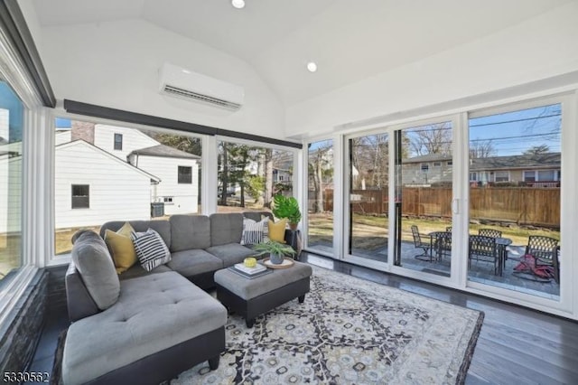 sunroom / solarium featuring lofted ceiling and a wall mounted AC