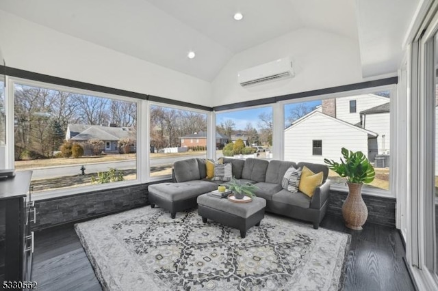 sunroom featuring an AC wall unit and lofted ceiling