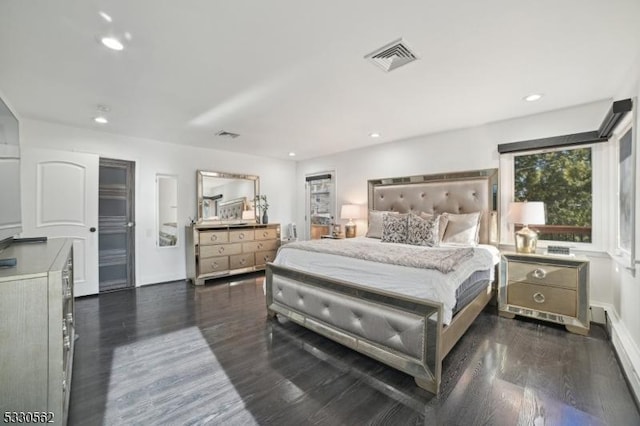 bedroom with recessed lighting, visible vents, and dark wood-type flooring