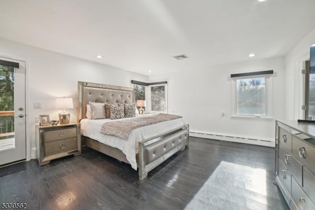 bedroom with dark wood finished floors, recessed lighting, visible vents, and baseboard heating