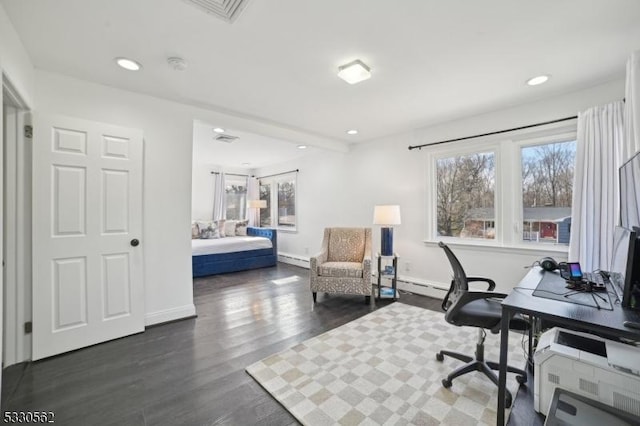 office space with recessed lighting, a baseboard radiator, dark wood-type flooring, and visible vents