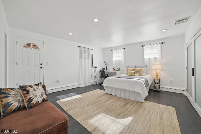 bedroom featuring recessed lighting, visible vents, dark wood-style floors, and a baseboard radiator