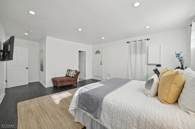 bedroom featuring recessed lighting, dark wood-type flooring, and baseboards