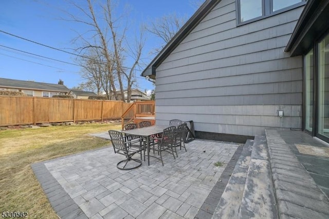 view of patio / terrace featuring outdoor dining area and fence