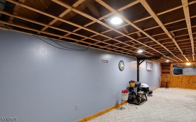 basement with carpet flooring