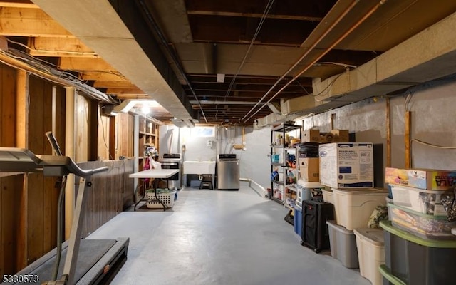 basement featuring sink and washer / clothes dryer