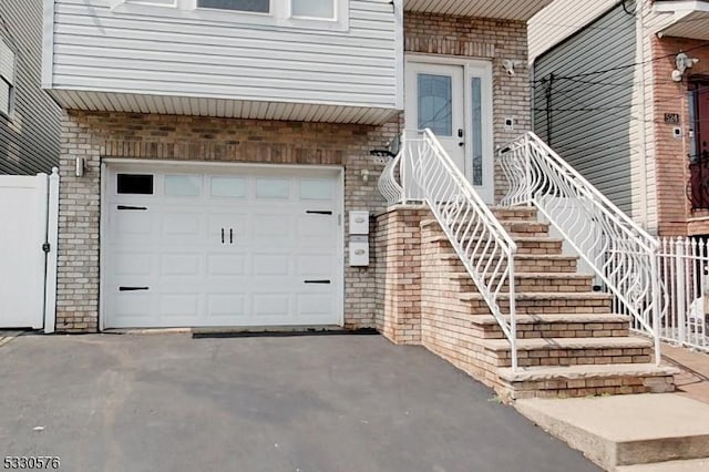 doorway to property with a garage