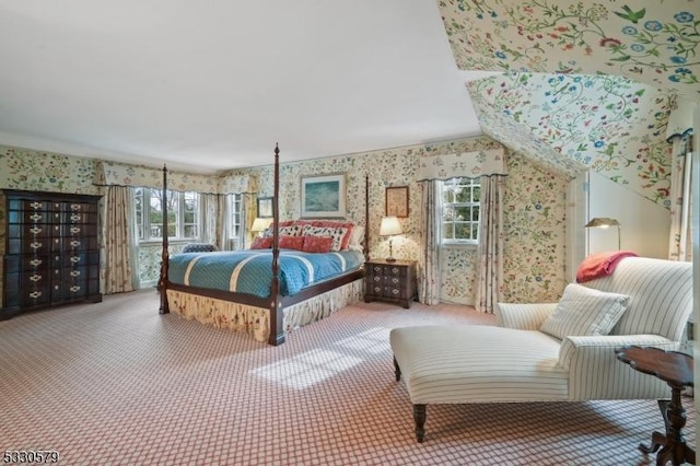 bedroom with vaulted ceiling and carpet floors