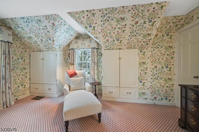 sitting room featuring light colored carpet