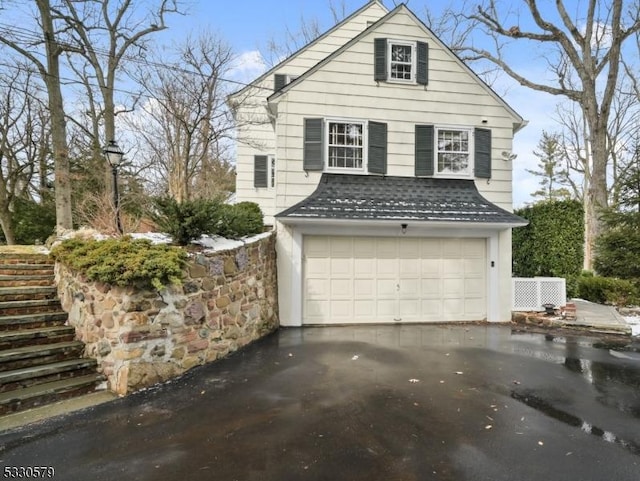 view of side of property with a garage